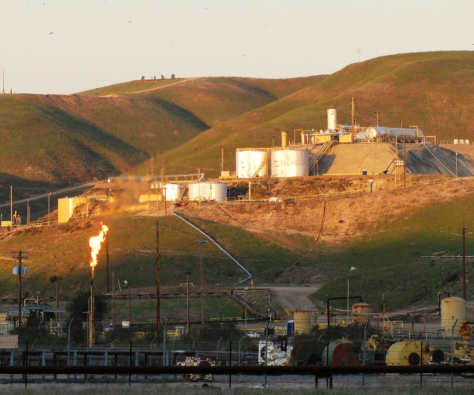 Storage tanks and a gas flare at a production site